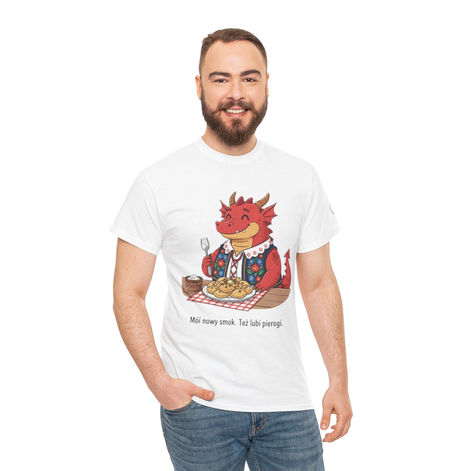 White t-shirt by S&W Gallus featuring a cartoon dragon eating pierogi and Polish text.
