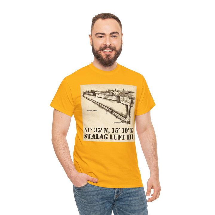 Mustard yellow graphic t-shirt by Veteran owned, featuring the coordinates of Stalag Luft III and a tunnel diagram, styled with blue jeans.