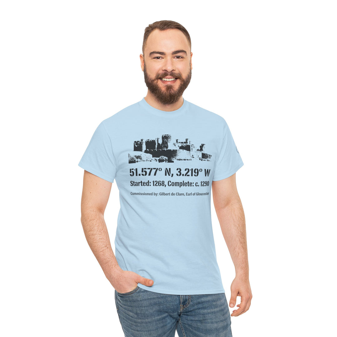 Light blue T-shirt by S&amp;W Gallus with castle graphic and coordinates, worn with jeans by a smiling man.
