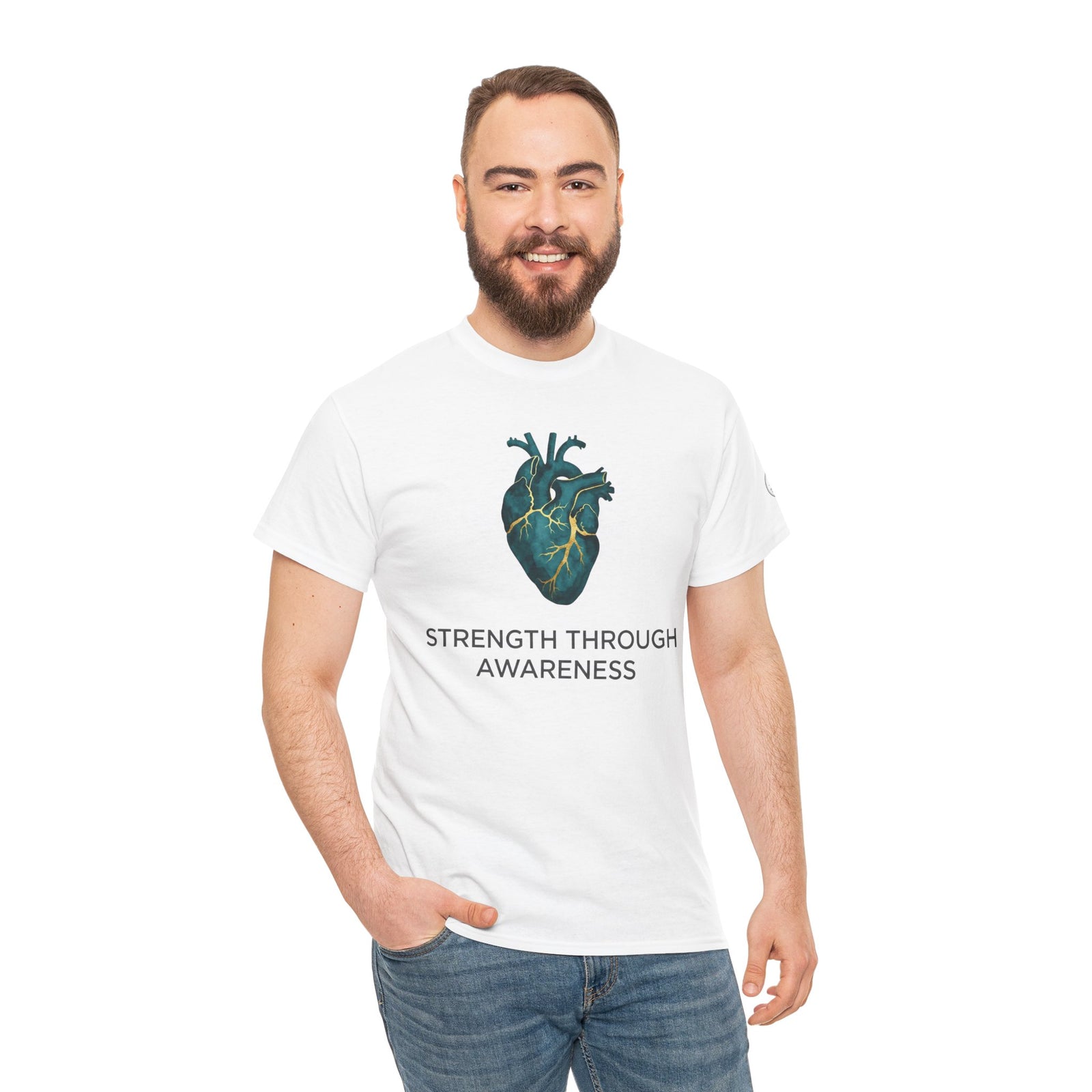 White t-shirt by Veteran owned, featuring a teal anatomical heart graphic and awareness text, worn with jeans.