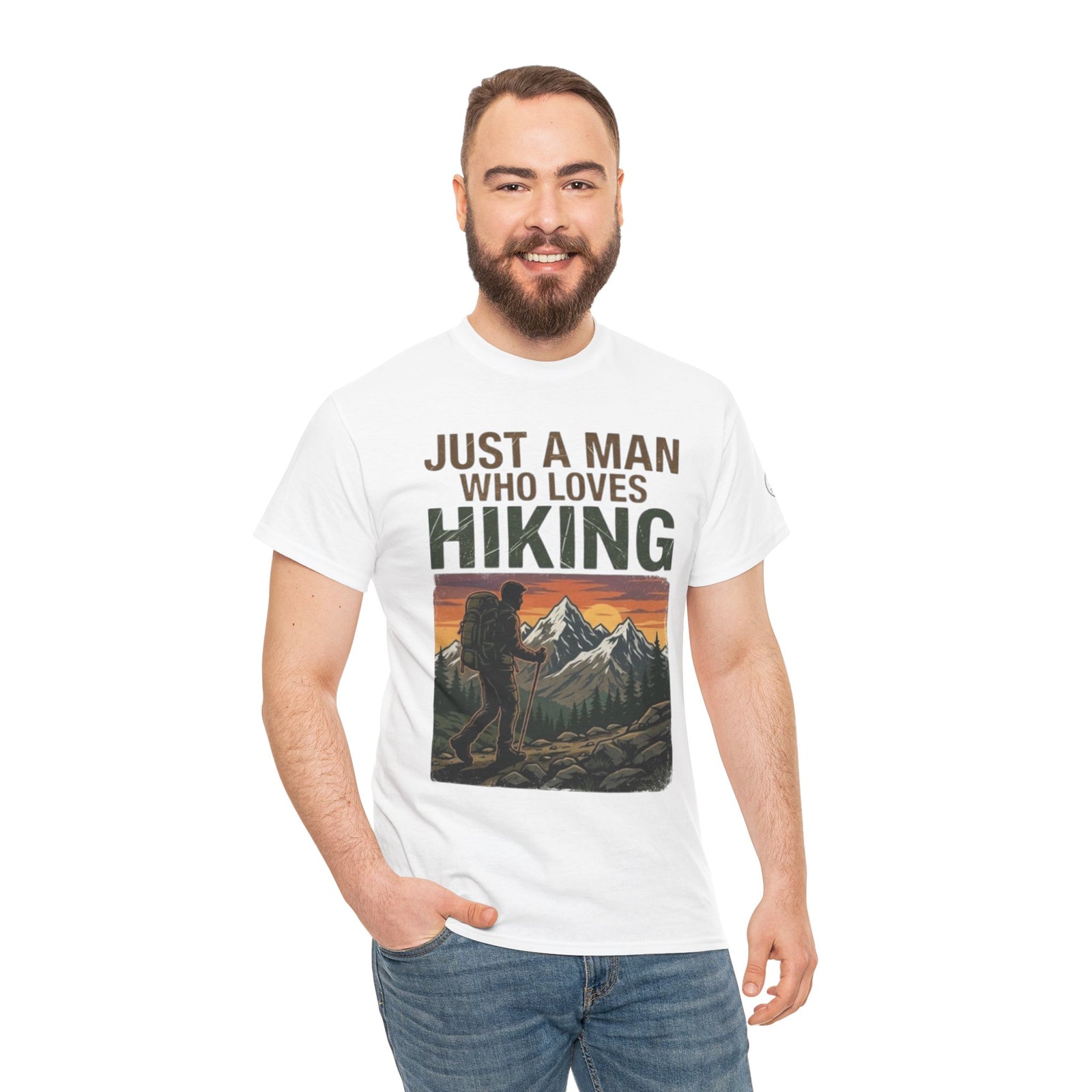 White hiking themed t-shirt by Veteran owned, featuring a graphic of a hiker and mountains on the front, worn with jeans.